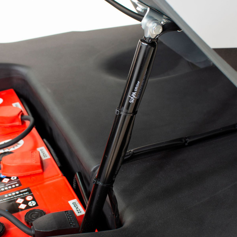 Muelle neumático para la apertura del compartimento de baterías